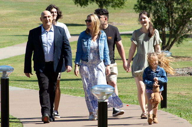 Solar Bollard Lighting team walking through outdoor space with installed solar bollard lights
