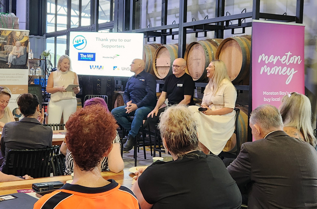 Solar lighting experts participating in industry panel discussion on innovation and sustainability