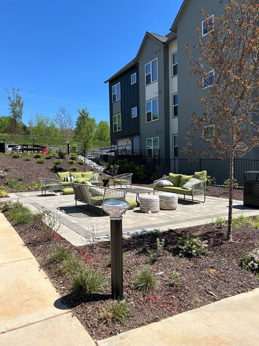 SBL2 solar bollard light installed beside outdoor seating area at Axis at the Park residential community Charlotte