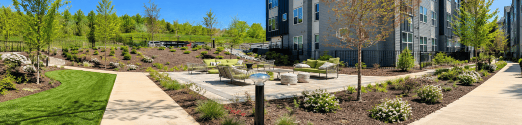 SBL2 solar bollard light beside the landscaped courtyard at Axis at the Park residential community in Charlotte, North Carolina.