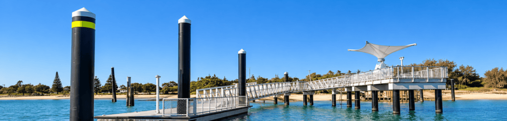Queensland marine jetty and pontoon infrastructure with solar lighting and navigation pylons.