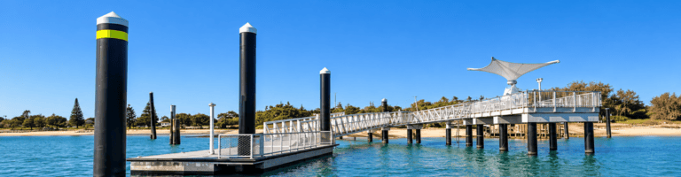 Queensland marine jetty and pontoon infrastructure with solar lighting and navigation pylons.