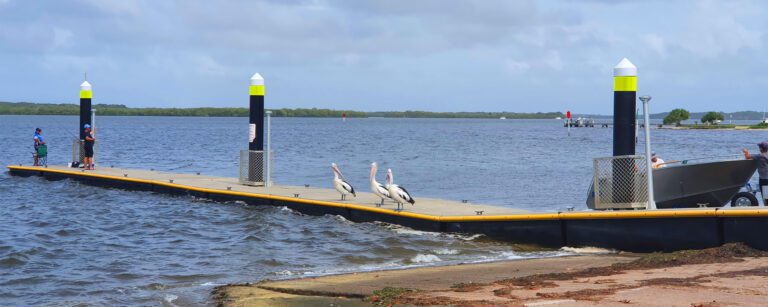 Queensland marine jetty and pontoon infrastructure with solar lighting and navigation pylons.
